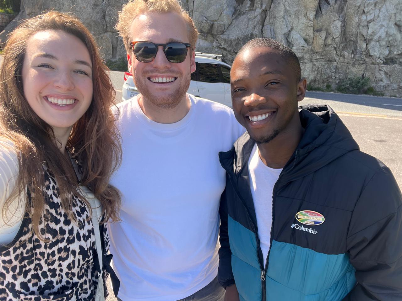 Guide and guests at a rocky Cape Peninsula viewpoint