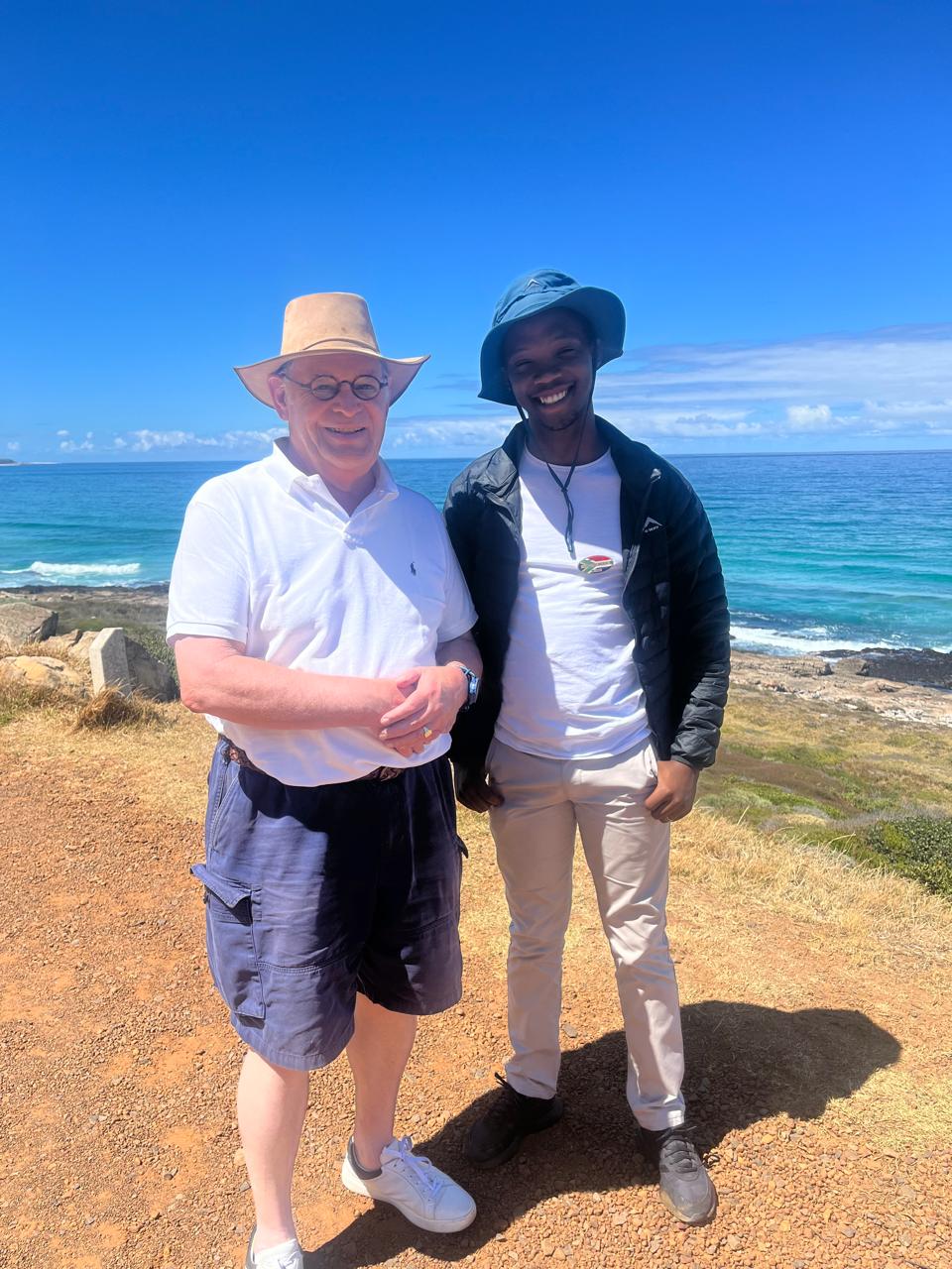 Tour guide and guest at Cape of Good Hope coastal viewpoint