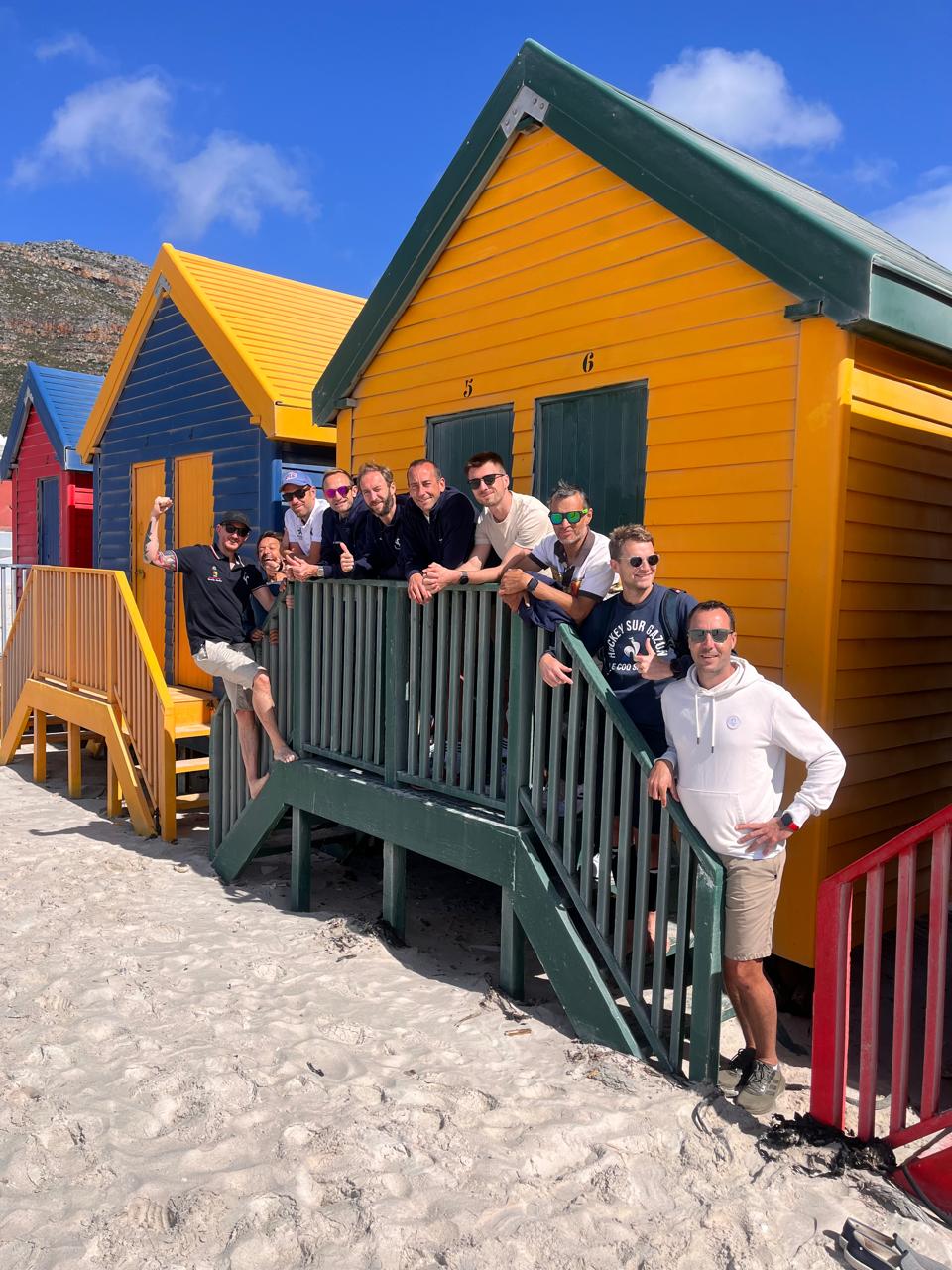 Tour group at the colorful St James beach huts, Cape Town