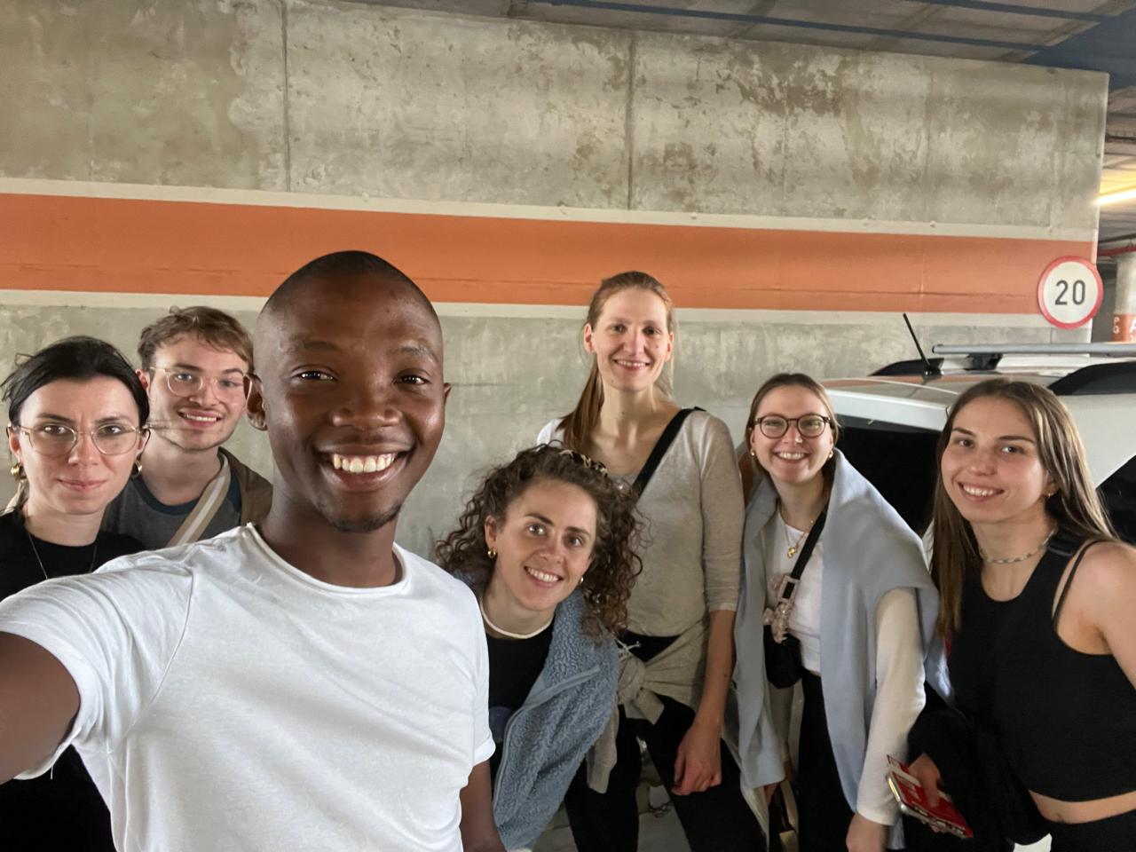 Guide and tour group smiling before setting off on a day tour