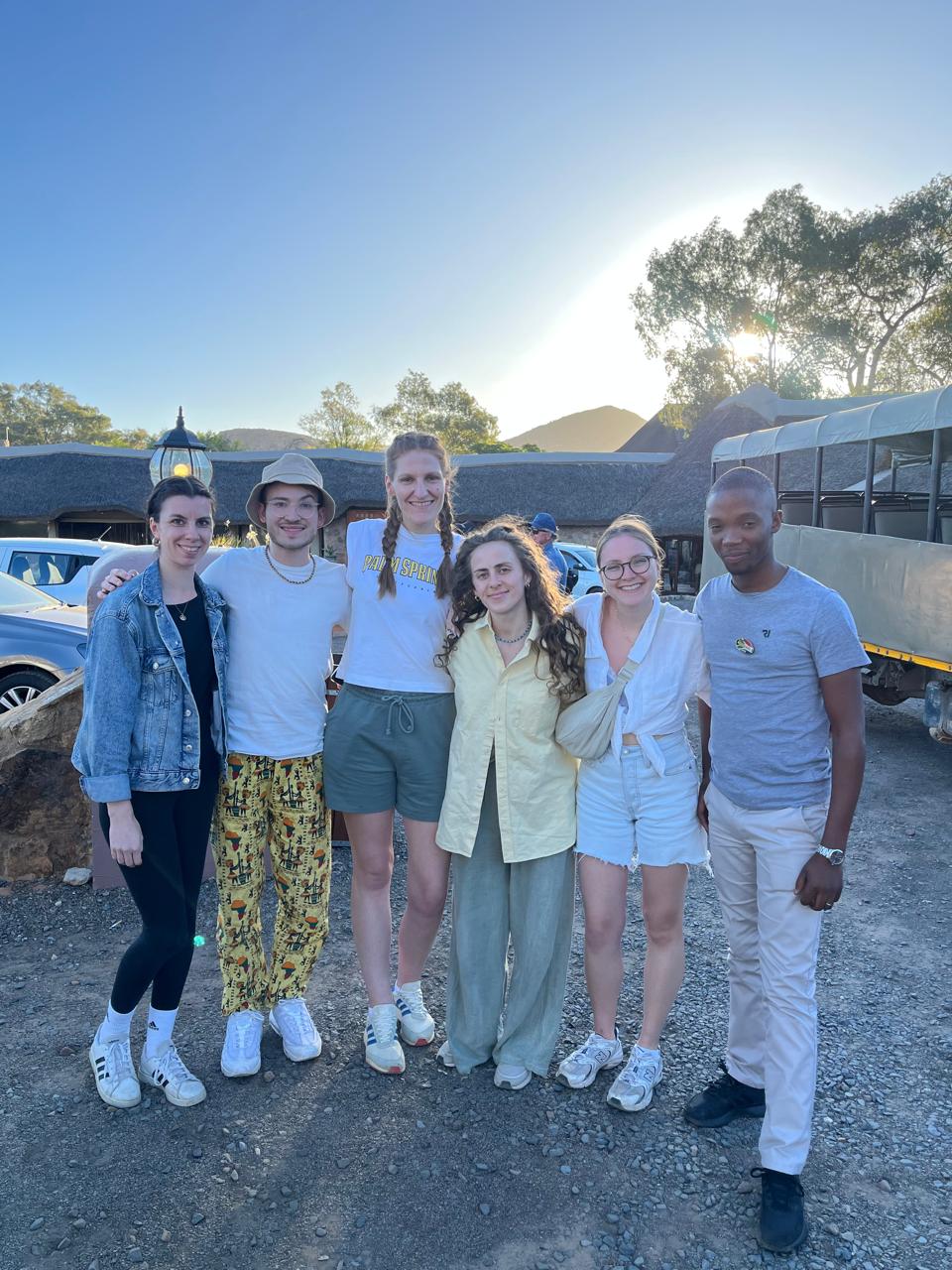 Safari tour group at a game lodge at golden hour, South Africa